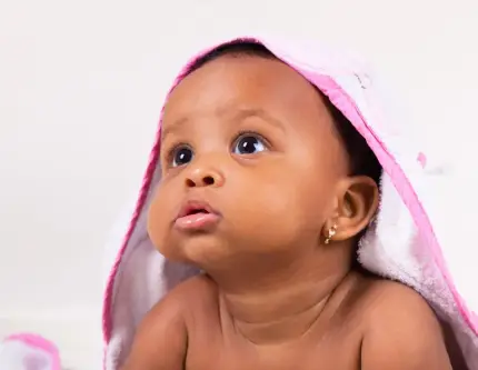 Newborn wrapped in a soft towel